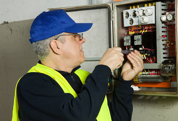 EV Charger Installer in Sydney working on Switchboard