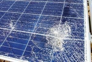 Solar panel with broken glass and damaged solar cells