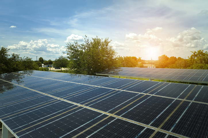 Solar panels installed over parking lot for parked cars for effective generation of clean energy